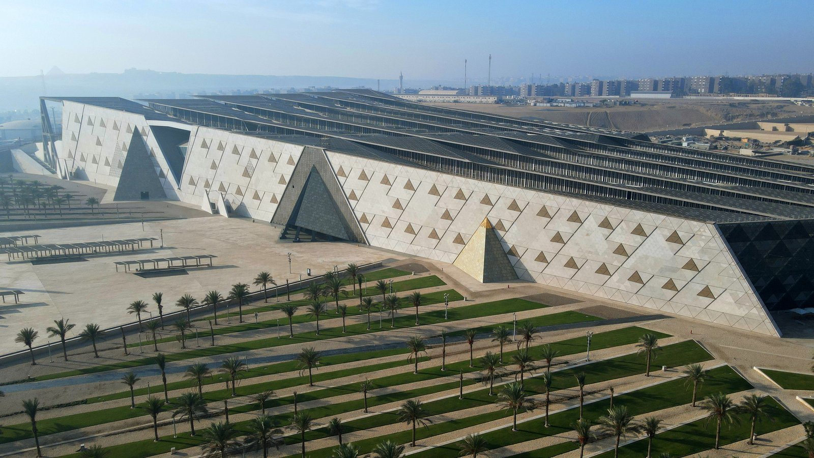 Aerial view of the Grand Egyptian Museum building and gardens in Giza, Egypt