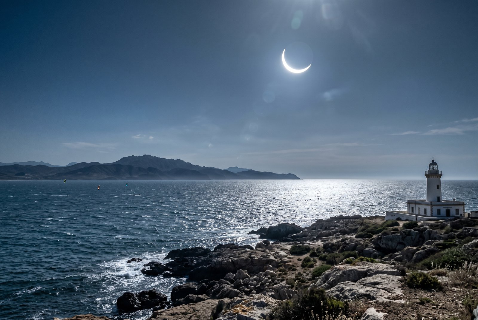 The partially eclipsed Sun over the Strait of Gibraltar with the coast of Morocco on the horizon